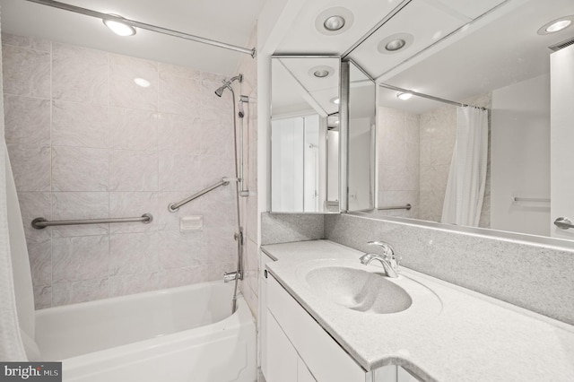 full bathroom featuring shower / bath combo, visible vents, and vanity