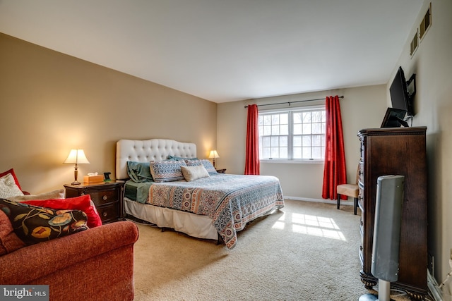 bedroom featuring light carpet, baseboards, and visible vents