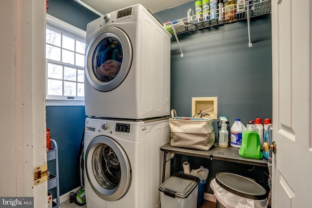 laundry room featuring laundry area and stacked washer / dryer