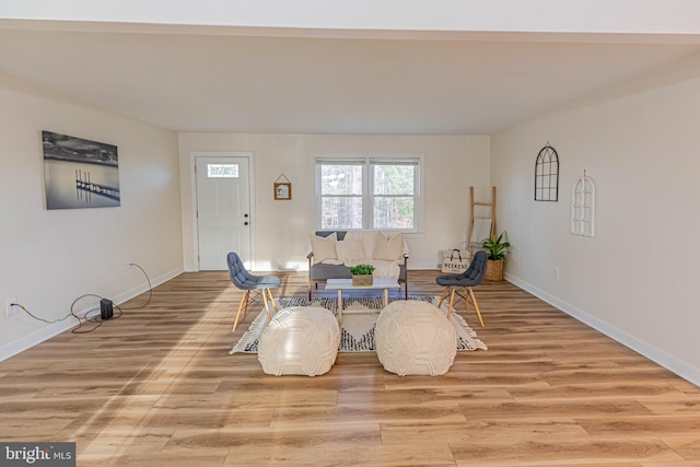 living room featuring light wood-style floors and baseboards