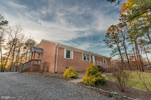 exterior space featuring brick siding