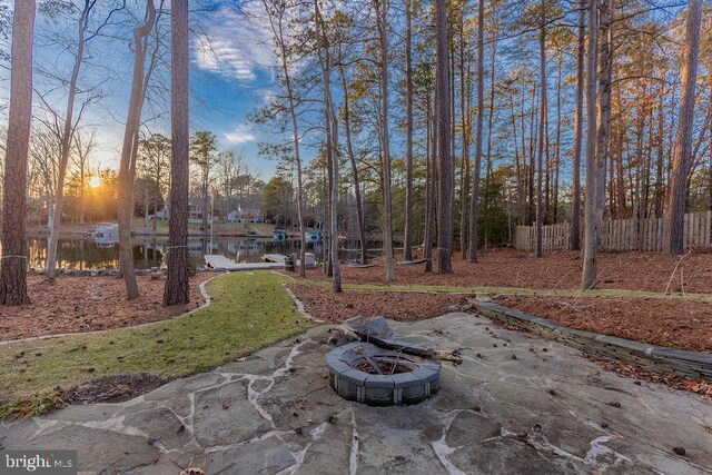 view of yard featuring a fire pit and fence