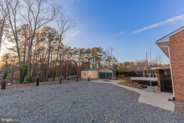 view of yard featuring an outbuilding and a wooden deck