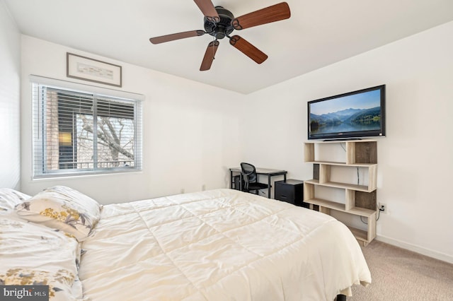 bedroom featuring baseboards, ceiling fan, and light colored carpet