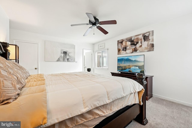 bedroom with light carpet, ceiling fan, and baseboards