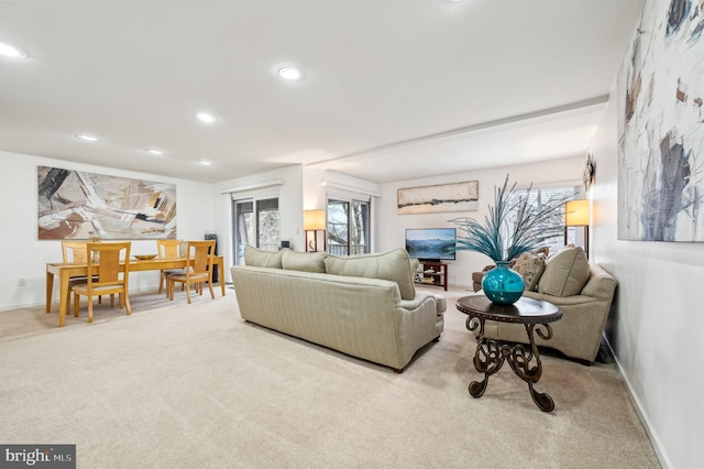 living area featuring recessed lighting, carpet flooring, and baseboards