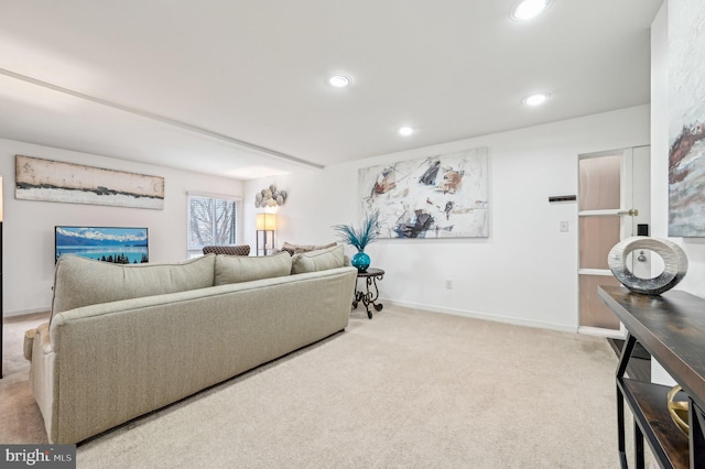 living area featuring baseboards, recessed lighting, and light colored carpet