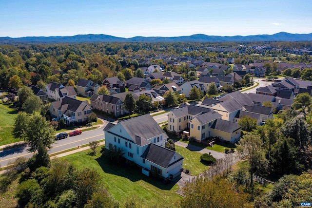 drone / aerial view featuring a residential view and a mountain view