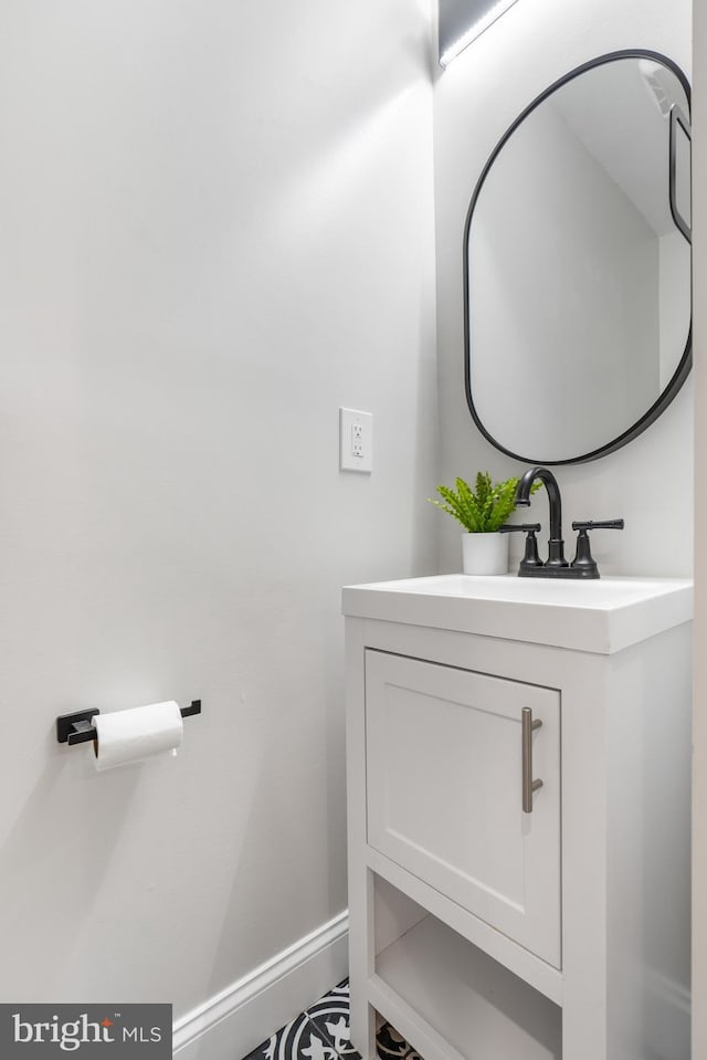 bathroom featuring vanity and baseboards