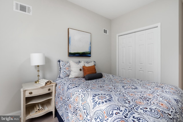 bedroom featuring a closet and visible vents