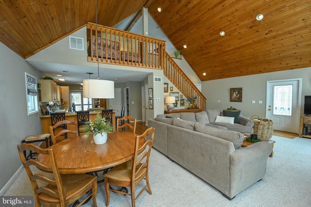 dining space with wooden ceiling, baseboards, stairs, and visible vents