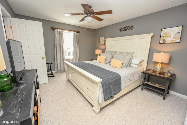 bedroom featuring ceiling fan and baseboards