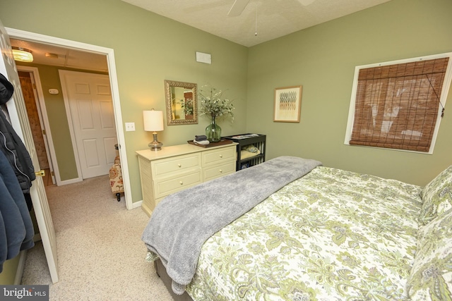 bedroom with baseboards and a ceiling fan