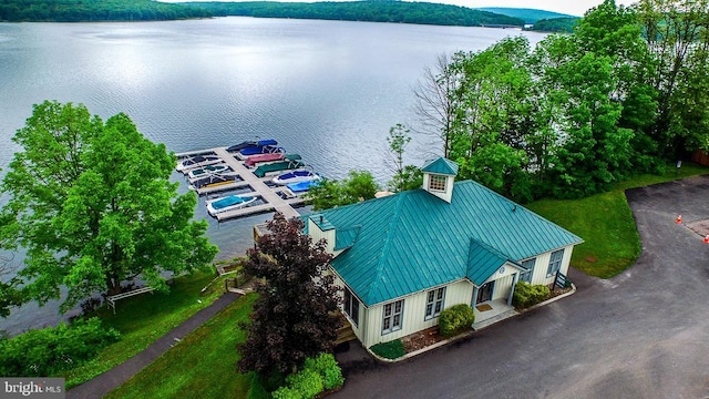 birds eye view of property with a water view