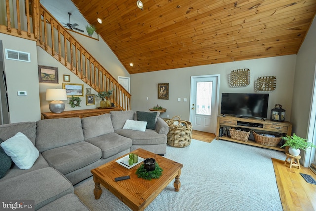 living room featuring high vaulted ceiling, wooden ceiling, visible vents, stairs, and light wood-type flooring