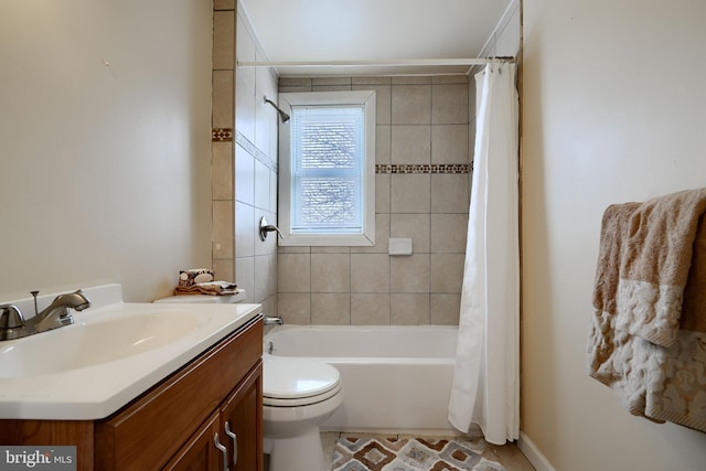 full bath featuring toilet, shower / tub combo with curtain, and vanity