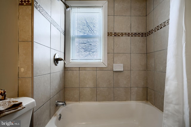 full bathroom with toilet and shower / bath combo