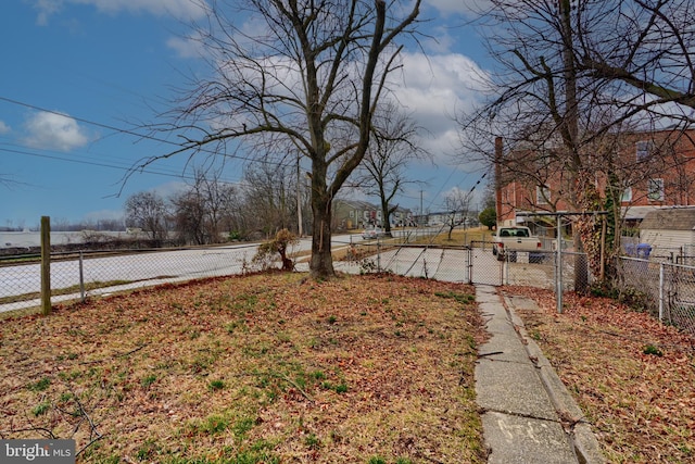 view of yard featuring a gate and fence