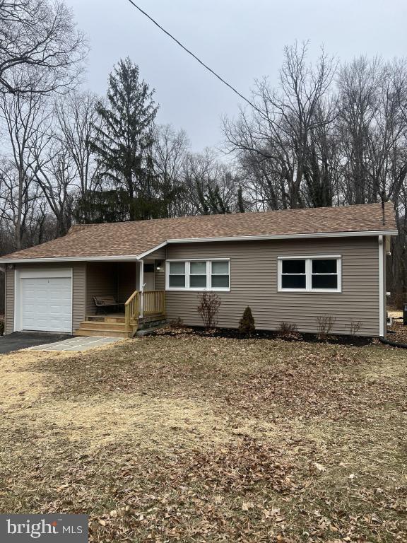 ranch-style house featuring an attached garage