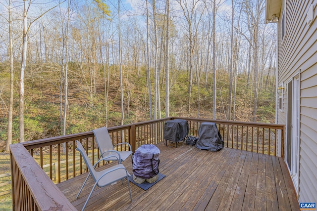 wooden deck with grilling area