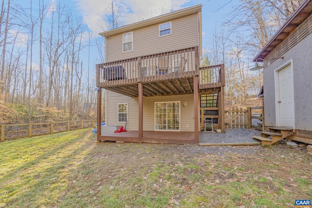 back of property featuring a yard, a fenced backyard, stairs, and a wooden deck