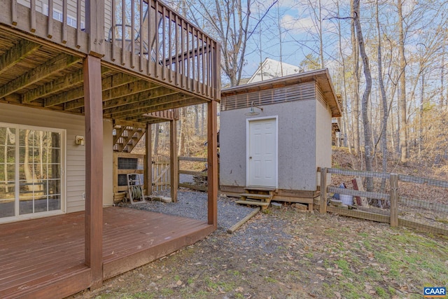 exterior space with fence and an outbuilding