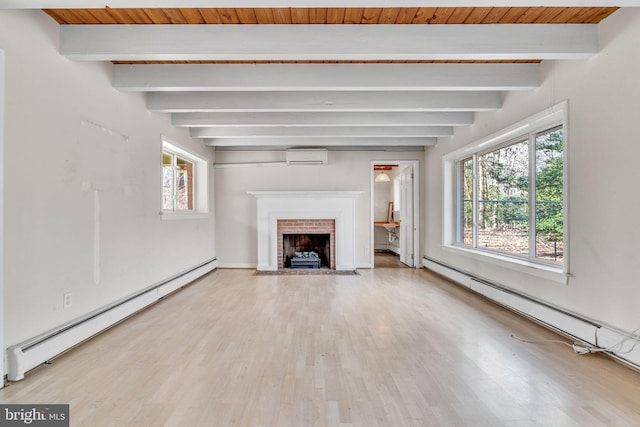 unfurnished living room featuring a baseboard heating unit, a baseboard radiator, a healthy amount of sunlight, and a wall mounted AC