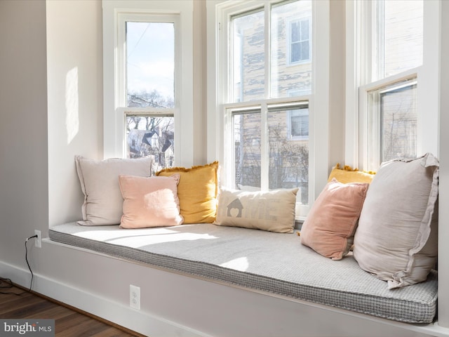 interior space with wood finished floors and baseboards