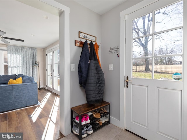 mudroom featuring ceiling fan, baseboards, and wood finished floors