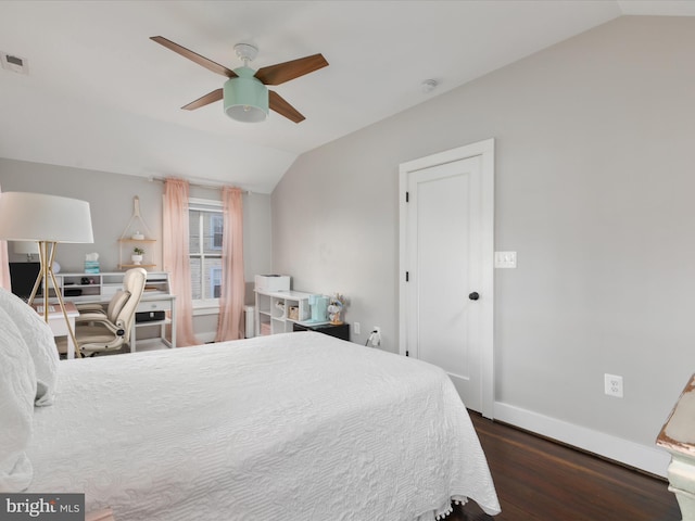 bedroom with wood finished floors, a ceiling fan, visible vents, vaulted ceiling, and baseboards