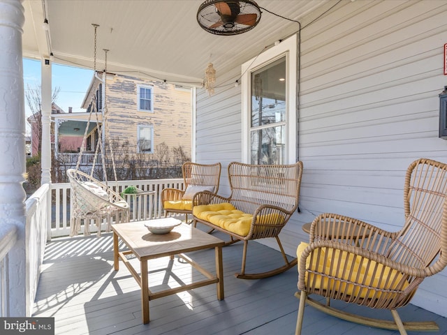 wooden terrace featuring a ceiling fan