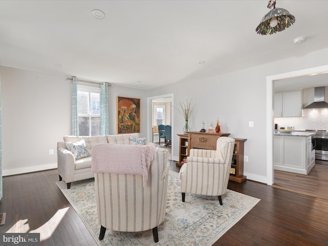 living room with dark wood-style floors and baseboards