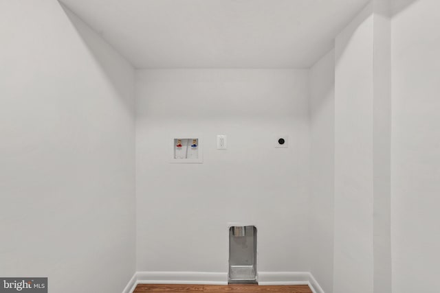 laundry area featuring baseboards, washer hookup, wood finished floors, and hookup for an electric dryer