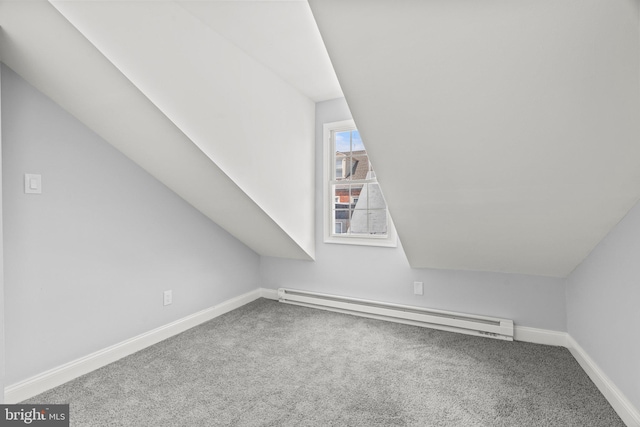 bonus room featuring carpet floors, a baseboard radiator, baseboards, and lofted ceiling