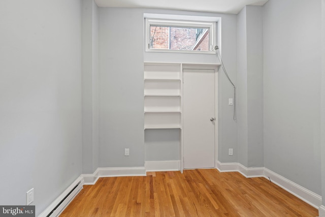 closet with a baseboard heating unit