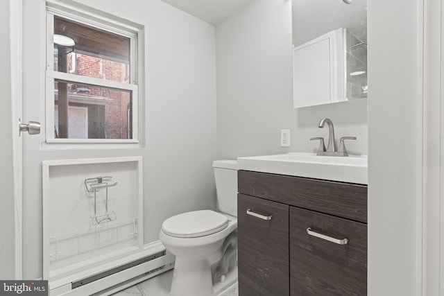 bathroom featuring a baseboard heating unit, toilet, and vanity