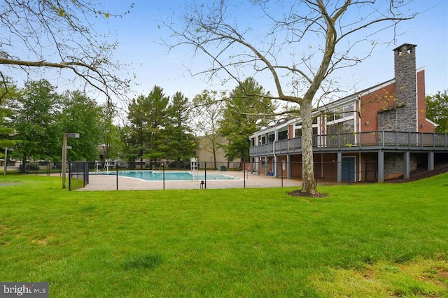 view of swimming pool with a fenced in pool, a patio area, a yard, and fence