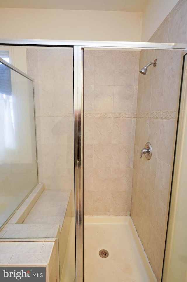 bathroom featuring a stall shower