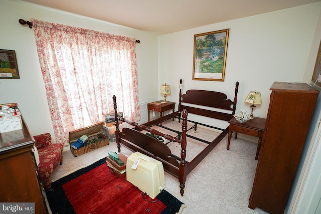 bedroom featuring light carpet