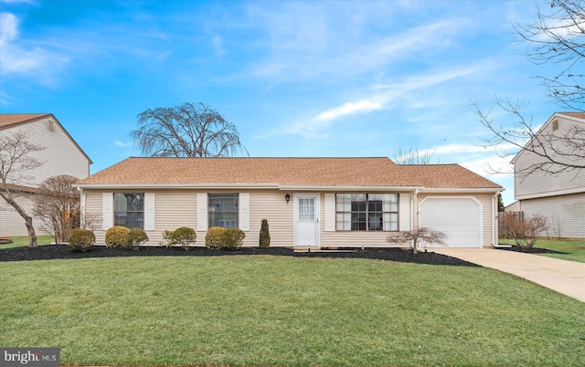 ranch-style house with concrete driveway, an attached garage, and a front lawn