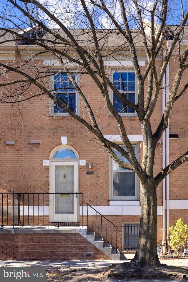 view of front of home featuring brick siding