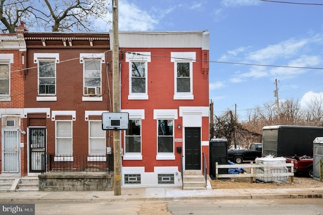 view of property featuring brick siding