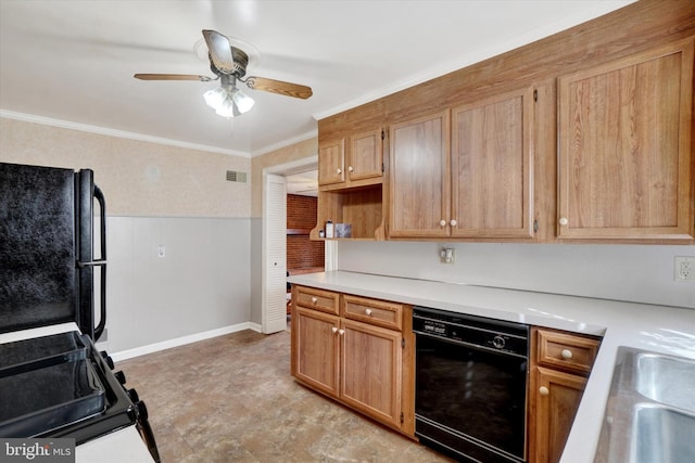 kitchen with a wainscoted wall, crown molding, light countertops, visible vents, and black appliances