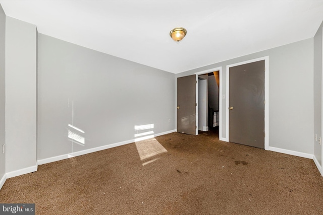 spare room with carpet floors and baseboards