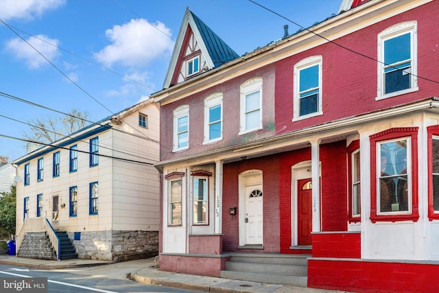 townhome / multi-family property with brick siding