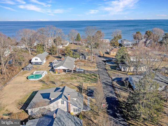 bird's eye view featuring a water view and a residential view