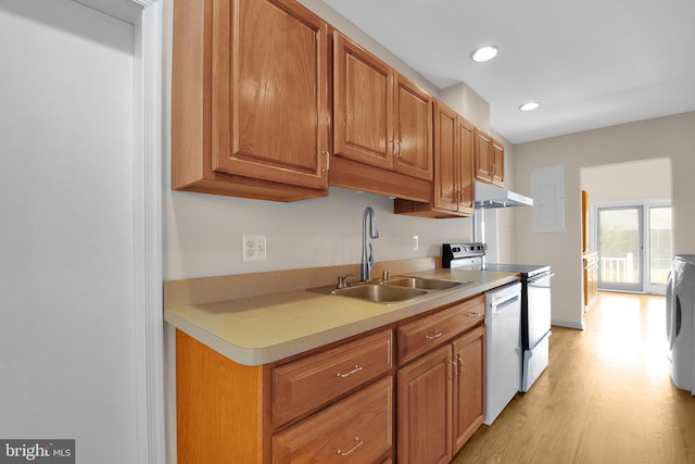 kitchen featuring white dishwasher, under cabinet range hood, electric range, a sink, and light countertops