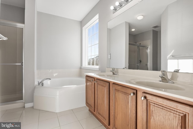 bathroom featuring double vanity, tile patterned flooring, a sink, and visible vents