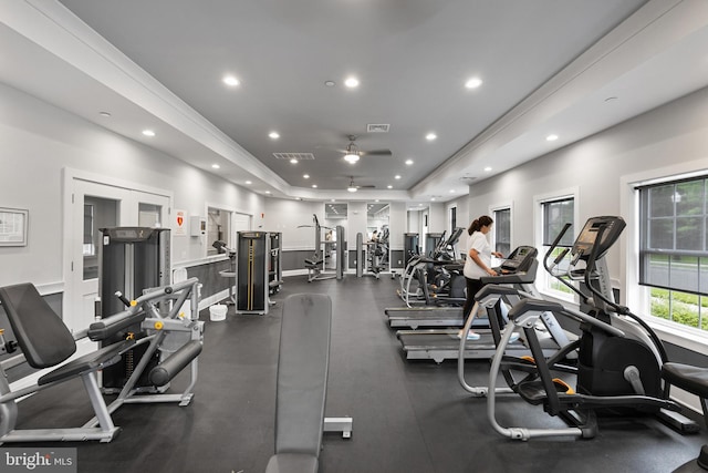 exercise room featuring french doors, a raised ceiling, visible vents, and recessed lighting