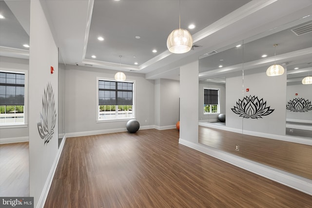 exercise area with recessed lighting, visible vents, baseboards, dark wood-style floors, and a raised ceiling